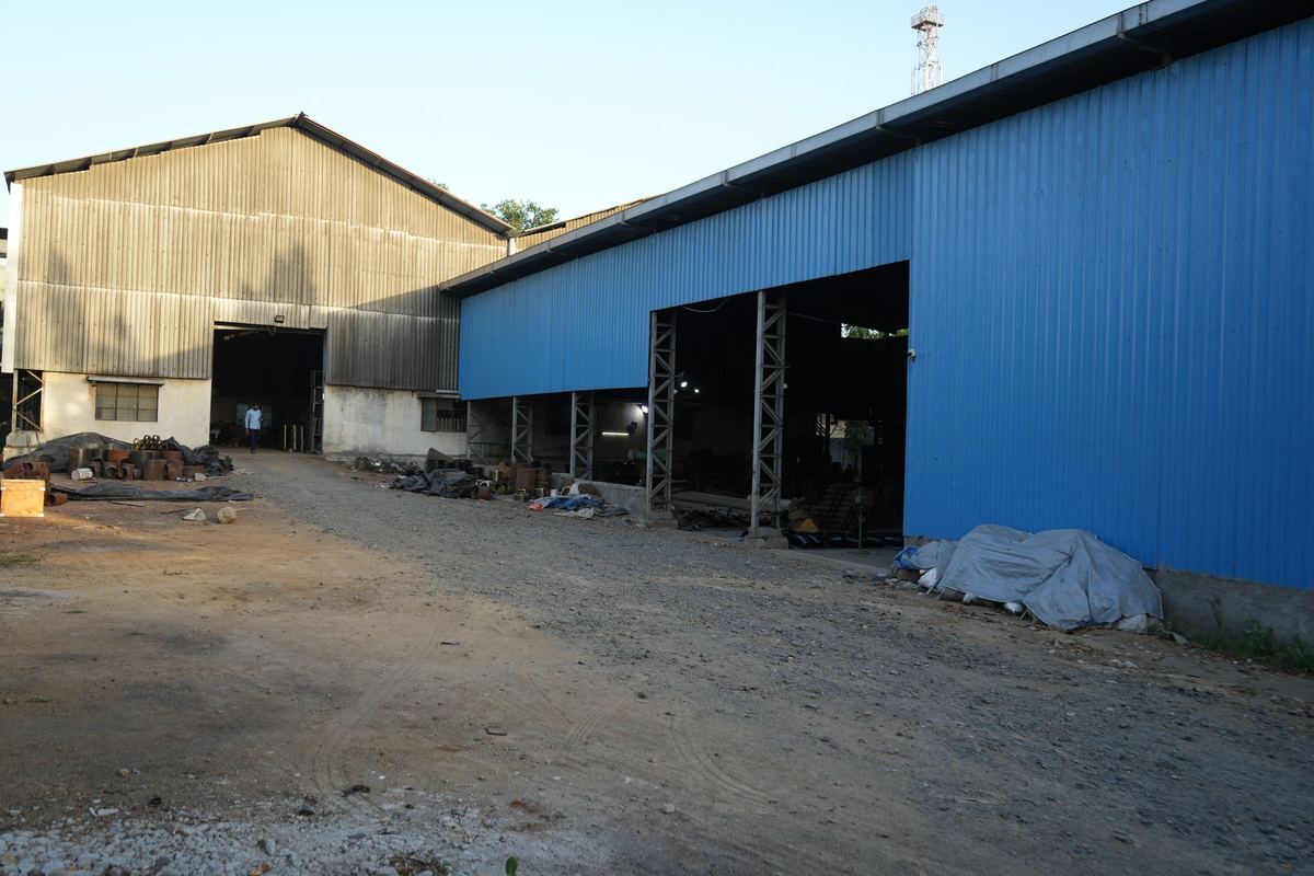 Steel-framed workshop sheds and the yard at our works in Gujarat